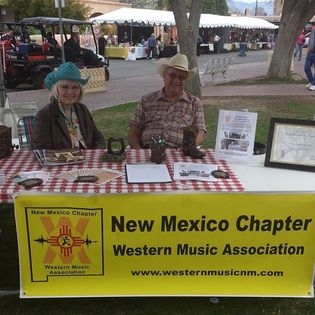 Linda and E. Joe Brown manning the New Mexico Chapter of IWMA table at the state fair.